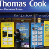A worker changes the window display of Thomas Cook in Loughborough, central England December 14, 2011. REUTERS/Darren Staples A worker changes the window display of Thomas Cook in Loughborough, central England December 14, 2011. REUTERS/Darren Staples