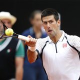 Novak Djokovic of Serbia hits a return to Alexandr Dolgopolov of Ukraine during their men's singles match at the Rome Masters tennis tournam Novak Djokovic of Serbia hits a return to Alexandr Dolgopolov of Ukraine during their men's singles match at the Rome Masters tennis tournam