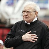 Berkshire Hathaway chairman Warren Buffett holds his hand over his heart during the singing of the national anthem, at the start of a 5km ra Berkshire Hathaway chairman Warren Buffett holds his hand over his heart during the singing of the national anthem, at the start of a 5km ra
