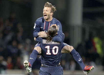 Paris Saint-Germain's Zlatan Ibrahimovic and David Beckham celebrate at the end of their team's French Ligue 1 soccer match against Olympiqu Paris Saint-Germain's Zlatan Ibrahimovic and David Beckham celebrate at the end of their team's French Ligue 1 soccer match against Olympiqu