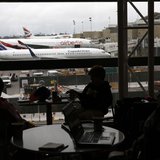 Passengers wait for their flights in the Tom Bradley International Terminal at Los Angeles International Airport (LAX), in Los Angeles, Cali Passengers wait for their flights in the Tom Bradley International Terminal at Los Angeles International Airport (LAX), in Los Angeles, Cali