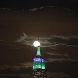 A full moon rises behind the Empire State Building in New York as seen from a park along the Hudson River in Hoboken, New Jersey, February 2 A full moon rises behind the Empire State Building in New York as seen from a park along the Hudson River in Hoboken, New Jersey, February 2