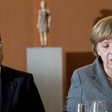 German Chancellor Angela Merkel (R) and French President Francois Hollande arrive for a dinner with representatives of the European Round Ta German Chancellor Angela Merkel (R) and French President Francois Hollande arrive for a dinner with representatives of the European Round Ta