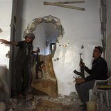 Free Syrian Army fighters take position inside a house in Deir al-Zor May 15, 2013. Picture taken May 15, 2013. REUTERS/Khalil Ashawi Free Syrian Army fighters take position inside a house in Deir al-Zor May 15, 2013. Picture taken May 15, 2013. REUTERS/Khalil Ashawi