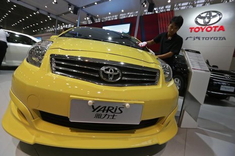 A worker cleans a Toyota Yaris car at the Wuhan Motor Show, Hubei province, October 12, 2012. REUTERS/Stringer A worker cleans a Toyota Yaris car at the Wuhan Motor Show, Hubei province, October 12, 2012. REUTERS/Stringer