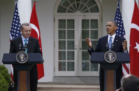 U.S. President Barack Obama (R) reacts to rain starting to fall, as he and Turkish Prime Minister Recep Tayyip Erdogan hold a joint news con U.S. President Barack Obama (R) reacts to rain starting to fall, as he and Turkish Prime Minister Recep Tayyip Erdogan hold a joint news con