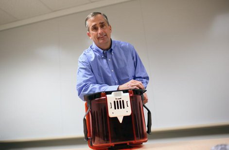 Intel Chief Operating Officer Brian Krzanich poses with a Front Opening Unified Pod, a transport unit for computer chip wafers, with each FO Intel Chief Operating Officer Brian Krzanich poses with a Front Opening Unified Pod, a transport unit for computer chip wafers, with each FO