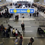 Passengers with their baggage move through the check-in area of the Tom Bradley International Terminal at Los Angeles International Airport Passengers with their baggage move through the check-in area of the Tom Bradley International Terminal at Los Angeles International Airport