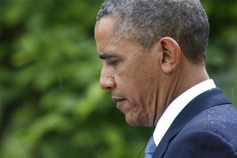 U.S. President Barack Obama listens to a question in the rain during a joint news conference with Turkish Prime Minister Recep Tayyip Erdoga U.S. President Barack Obama listens to a question in the rain during a joint news conference with Turkish Prime Minister Recep Tayyip Erdoga