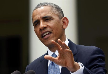U.S. President Barack Obama answers a question in the rain during a joint news conference with Turkish Prime Minister Recep Tayyip Erdogan i U.S. President Barack Obama answers a question in the rain during a joint news conference with Turkish Prime Minister Recep Tayyip Erdogan i