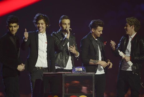 Pop group One Direction react after being awarded the Global Success award at the BRIT Awards, celebrating British pop music, at the O2 Aren Pop group One Direction react after being awarded the Global Success award at the BRIT Awards, celebrating British pop music, at the O2 Aren