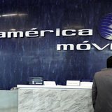 The logo of America Movil is seen on the wall of the reception area in the company's corporate offices in Mexico City February 13, 2013. REU The logo of America Movil is seen on the wall of the reception area in the company's corporate offices in Mexico City February 13, 2013. REU