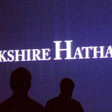 Berkshire Hathaway shareholders walk by a video screen at the company's annual meeting in Omaha May 4, 2013. REUTERS/Rick Wilking Berkshire Hathaway shareholders walk by a video screen at the company's annual meeting in Omaha May 4, 2013. REUTERS/Rick Wilking