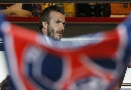Paris Saint-Germain's David Beckham takes his seat in the stands during their French Ligue 1 soccer match against Valenciennes at the Parc d Paris Saint-Germain's David Beckham takes his seat in the stands during their French Ligue 1 soccer match against Valenciennes at the Parc d