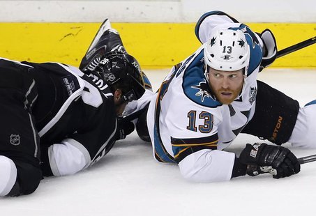 San Jose Sharks left wing Raffi Torres (13) looks up after hitting Los Angeles Kings center Jarret Stoll (28) to the ice in the second perio San Jose Sharks left wing Raffi Torres (13) looks up after hitting Los Angeles Kings center Jarret Stoll (28) to the ice in the second perio