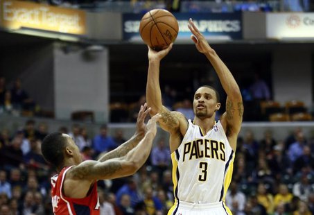 Indiana Pacers guard George Hill (3) shoots the basketball over Atlanta Hawks guard Jeff Teague during the first half of their NBA first rou Indiana Pacers guard George Hill (3) shoots the basketball over Atlanta Hawks guard Jeff Teague during the first half of their NBA first rou