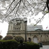 A man takes pictures in front of the Bank of Japan building in Tokyo, March 29, 2013. REUTERS/Yuya Shino A man takes pictures in front of the Bank of Japan building in Tokyo, March 29, 2013. REUTERS/Yuya Shino
