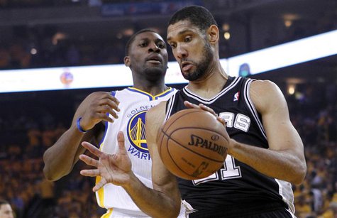 San Antonio Spurs' Tim Duncan (R) takes a rebound from Golden State Warriors' Festus Ezeli during Game 6 of their NBA Western Conference sem San Antonio Spurs' Tim Duncan (R) takes a rebound from Golden State Warriors' Festus Ezeli during Game 6 of their NBA Western Conference sem