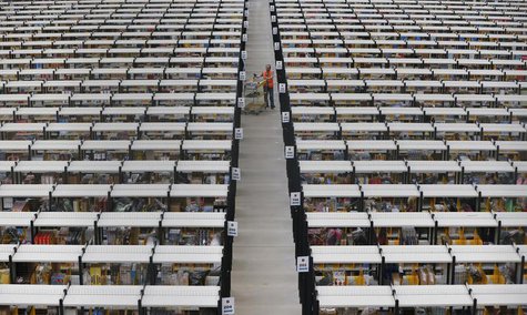 A worker collects orders at Amazon's fulfilment centre in Rugeley, central England December 11, 2012. REUTERS/Phil Noble A worker collects orders at Amazon's fulfilment centre in Rugeley, central England December 11, 2012. REUTERS/Phil Noble