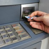 A man uses a traditional automated teller machine (ATM) in Bucharest May 17, 2013. REUTERS/Bogdan Cristel A man uses a traditional automated teller machine (ATM) in Bucharest May 17, 2013. REUTERS/Bogdan Cristel
