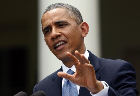 U.S. President Barack Obama answers a question in the rain during a joint news conference with Turkish Prime Minister Recep Tayyip Erdogan i U.S. President Barack Obama answers a question in the rain during a joint news conference with Turkish Prime Minister Recep Tayyip Erdogan i