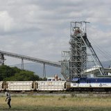 A man walks past a train carrying goods, at Anglo Platinum's Khomanani shaft 1 mine in Rustenburg, northwest of Johannesburg January 15, 201 A man walks past a train carrying goods, at Anglo Platinum's Khomanani shaft 1 mine in Rustenburg, northwest of Johannesburg January 15, 201