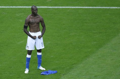 Italy's Mario Balotelli celebrates after scoring his second goal against Germany during their Euro 2012 semi-final soccer match at the Natio Italy's Mario Balotelli celebrates after scoring his second goal against Germany during their Euro 2012 semi-final soccer match at the Natio