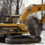 A Caterpillar excavator machine is seen at a work site in Detroit, Michigan January 25, 2013. REUTERS/ Rebecca Cook A Caterpillar excavator machine is seen at a work site in Detroit, Michigan January 25, 2013. REUTERS/ Rebecca Cook