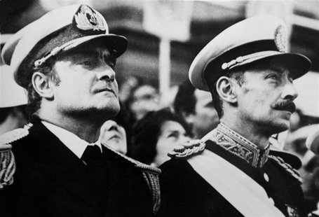 Argentine Army General Jorge Videla (R), leader of the 1976 military coup that began the seven-year "Dirty War," stands next to junta member Argentine Army General Jorge Videla (R), leader of the 1976 military coup that began the seven-year "Dirty War," stands next to junta member