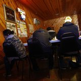 A group of illegal immigrants, who handed themselves in to U.S. Border Patrol, sit in a restaurant in Encino, Texas March 29, 2013. REUTERS/ A group of illegal immigrants, who handed themselves in to U.S. Border Patrol, sit in a restaurant in Encino, Texas March 29, 2013. REUTERS/