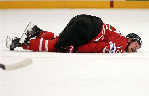 Canada's Eric Staal (R) lies injured on the ice during their 2013 IIHF Ice Hockey World Championship quarter-final match against Sweden at t Canada's Eric Staal (R) lies injured on the ice during their 2013 IIHF Ice Hockey World Championship quarter-final match against Sweden at t