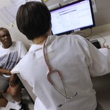 Patient Thomas West speaks to Dr. Lisa Vinci during his check up at University of Chicago Medicine Primary Care Clinic in Chicago June 28, 2 Patient Thomas West speaks to Dr. Lisa Vinci during his check up at University of Chicago Medicine Primary Care Clinic in Chicago June 28, 2