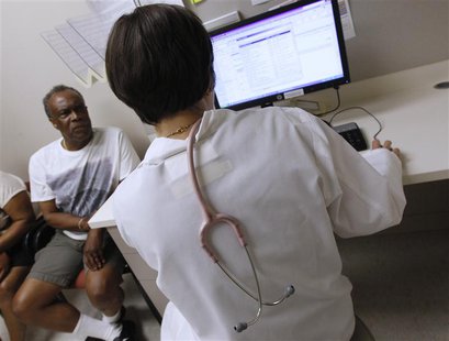 Patient Thomas West speaks to Dr. Lisa Vinci during his check up at University of Chicago Medicine Primary Care Clinic in Chicago June 28, 2 Patient Thomas West speaks to Dr. Lisa Vinci during his check up at University of Chicago Medicine Primary Care Clinic in Chicago June 28, 2