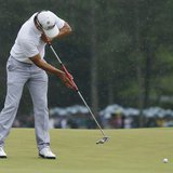 Adam Scott of Australia sinks a birdie putt on the 18th green during final round play in the 2013 Masters golf tournament at the Augusta Nat Adam Scott of Australia sinks a birdie putt on the 18th green during final round play in the 2013 Masters golf tournament at the Augusta Nat