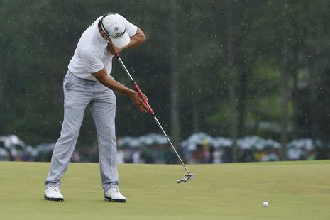 Adam Scott of Australia sinks a birdie putt on the 18th green during final round play in the 2013 Masters golf tournament at the Augusta Nat Adam Scott of Australia sinks a birdie putt on the 18th green during final round play in the 2013 Masters golf tournament at the Augusta Nat