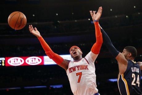 New York Knicks' Carmelo Anthony reacts as he has his shot blocked by Indiana Pacers' Paul George during the second quarter in Game 5 of the New York Knicks' Carmelo Anthony reacts as he has his shot blocked by Indiana Pacers' Paul George during the second quarter in Game 5 of the