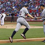 FALSE HOPES: Detroit Tigers OF Don Kelly is congratulated by third base coach Tom Brookens after hitting a home run as Texas Rangers starting pitcher Yu Darvish grabs a rosin bag in the first inning of their MLB American League baseball game in Arlington, Texas May 16, 2013. The Rangers went on to win, 10-4. REUTERS/Mike Stone