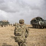 U.S. Army soldiers with Charlie Company, 36th Infantry Regiment, 1st Armored Division head back to their vehicles at the end of a mission ne U.S. Army soldiers with Charlie Company, 36th Infantry Regiment, 1st Armored Division head back to their vehicles at the end of a mission ne