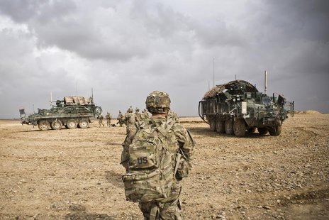 U.S. Army soldiers with Charlie Company, 36th Infantry Regiment, 1st Armored Division head back to their vehicles at the end of a mission ne U.S. Army soldiers with Charlie Company, 36th Infantry Regiment, 1st Armored Division head back to their vehicles at the end of a mission ne