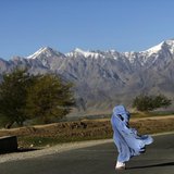 An Afghan woman in a burqa walks along a road on a windy day on the outskirts of Kabul April 16, 2013. REUTERS/Mohammad Ismail An Afghan woman in a burqa walks along a road on a windy day on the outskirts of Kabul April 16, 2013. REUTERS/Mohammad Ismail