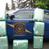 The State Police photo of Pot bales piled up against a cruiser. The State Police photo of Pot bales piled up against a cruiser.