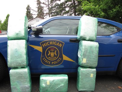 The State Police photo of Pot bales piled up against a cruiser. The State Police photo of Pot bales piled up against a cruiser.