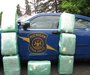 The State Police photo of Pot bales piled up against a cruiser. 