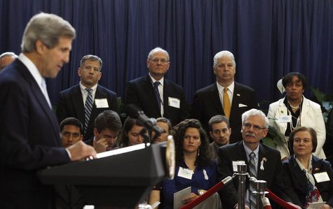 Family members of deceased State Department diplomat Anne Smedinghoff, (front row L-R) sister Regina, father Tom, and mother Mary Beth liste Family members of deceased State Department diplomat Anne Smedinghoff, (front row L-R) sister Regina, father Tom, and mother Mary Beth liste
