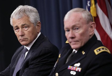 U.S. Secretary of Defense Chuck Hagel (L) and Joint Chiefs of Staff General Martin Dempsey hold a joint news conference at the Pentagon in W U.S. Secretary of Defense Chuck Hagel (L) and Joint Chiefs of Staff General Martin Dempsey hold a joint news conference at the Pentagon in W
