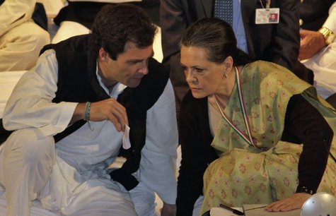 Rahul Gandhi, a lawmaker, speaks to Sonia Gandhi (R), who is his mother and India's ruling Congress party chief, during the Indian National Rahul Gandhi, a lawmaker, speaks to Sonia Gandhi (R), who is his mother and India's ruling Congress party chief, during the Indian National