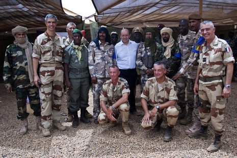 French Defence Minister Jean-Yves Le Drian (C) poses for a picture with French and Malian army officers at the French military base at the a French Defence Minister Jean-Yves Le Drian (C) poses for a picture with French and Malian army officers at the French military base at the a