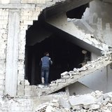A man is seen on a damaged staircase in Homs, May 19, 2013. REUTERS/Yazen Homsy A man is seen on a damaged staircase in Homs, May 19, 2013. REUTERS/Yazen Homsy