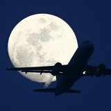 A passenger aircraft is silhouetted against the rising moon in New Delhi May 7, 2009. REUTERS/B Mathur A passenger aircraft is silhouetted against the rising moon in New Delhi May 7, 2009. REUTERS/B Mathur