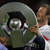 Paris Saint-Germain's David Beckham raises the French Championship trophy at the end of their team's French Ligue 1 soccer match against Bre Paris Saint-Germain's David Beckham raises the French Championship trophy at the end of their team's French Ligue 1 soccer match against Bre